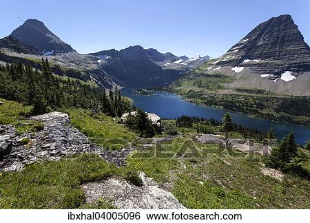 Stock Photograph - "Hidden Lake with Reynolds Mountains and Bearhat Mountains, Glacier National Park, Montana, United States, North America". Fotosearch