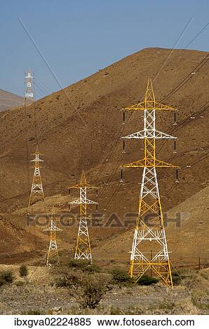 "High voltage cables with red and white pylons crossing the barren slopes of the Al Hajar Mountains, Sultanate of Oman, Middle East, Asia" View Large Photo Image Stock Photography - "High voltage cables with red and white pylons crossing the barren slopes of the Al Hajar Mountains, Sultanate of Oman, Middle East, Asia". Fotosearch