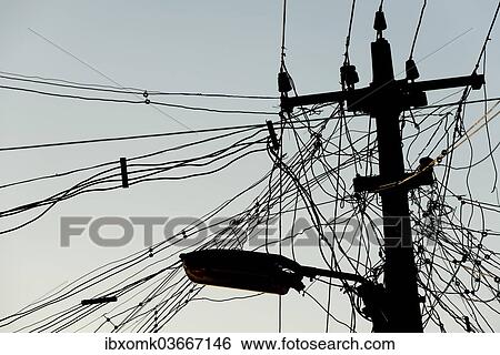 "High voltage power line and tangled cables, Madurai, Tamil Nadu, India, Asia" View Large Photo Image Stock Photograph - "High voltage power line and tangled cables, Madurai, Tamil Nadu, India, Asia". Fotosearch