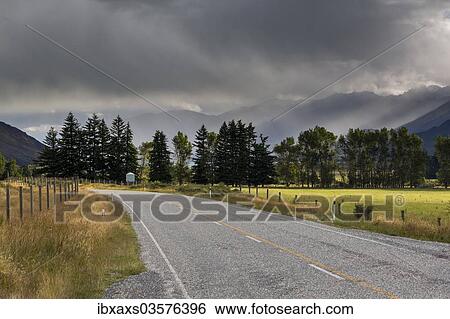 "Highway, rain clouds above Lake Wanaka, Makarora, Otago Region, New Zealand, Oceania" View Large Photo Image Stock Photograph - "Highway, rain clouds above Lake Wanaka, Makarora, Otago Region, New Zealand, Oceania". Fotosearch