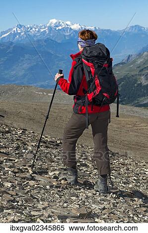 "Hiker ascending to the Pointe de la Plaine Morte crossing the Rhone valley, walking to the summit of Mont Blanc mountain in France, canton of Valais, Switzerland, Europe" View Large Photo Image Stock Photography - "Hiker ascending to the Pointe de la Plaine Morte crossing the Rhone valley, walking to the summit of Mont Blanc mountain in France, canton of Valais, Switzerland, Europe". Fotosearch