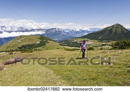 "Hiker climbing Cornet mountain, Monte Bondone mountain, province of Trento, Italy, Europe" View Large Photo Image Stock Image - "Hiker climbing Cornet mountain, Monte Bondone mountain, province of Trento, Italy, Europe". Fotosearch