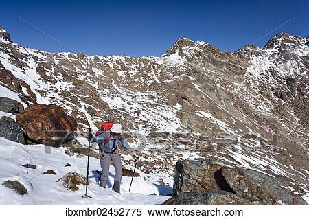 "Hiker during the ascent of Hintere Eggenspitze Mountain in the Ulten Valley, looking towards Zufrittspitz Mountain, Alto Adige, Italy, Europe" View Large Photo Image Stock Photography - "Hiker during the ascent of Hintere Eggenspitze Mountain in the Ulten Valley, looking towards Zufrittspitz Mountain, Alto Adige, Italy, Europe". Fotosearch