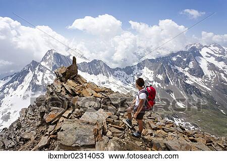 "Hiker during the ascent to the peak of Hohe Wilde mountain in the Pfossental valley, Hohe Wilde mountain at the back, Schnalstal valley, province of Bolzano-Bozen, Italy, Europe" View Large Photo Image Stock Image - "Hiker during the ascent to the peak of Hohe Wilde mountain in the Pfossental valley, Hohe Wilde mountain at the back, Schnalstal valley, province of Bolzano-Bozen, Italy, Europe". Fotosearch