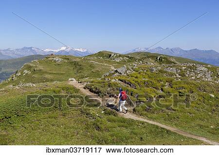 Stock Photo - "Hiker on Lammersdorfer Berg mountain, Millstatt am See, Spittal an der Drau, Carinthia, Austria, Europe". Fotosearch