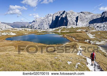 "Hikers descending from the Rifugio Antonio Locatelli S. Innerkofler, at the Boedenseen lakes, Mt Cima Una on the right, Mt Croda Rossa di Sesto in the back, Hochpustertal valley or Alta Pusteria, Sexten, Dolomites, South Tyrol, Italy, Europe" View Large Photo Image Stock Photography - "Hikers descending from the Rifugio Antonio Locatelli S. Innerkofler, at the Boedenseen lakes, Mt Cima Una on the right, Mt Croda Rossa di Sesto in the back, Hochpustertal valley or Alta Pusteria, Sexten, Dolomites, South Tyrol, Italy, Europe". Fotosearch