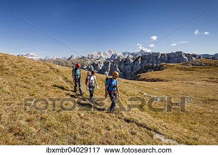 "Hikers during the ascent to Cima Valacia on the Via Ferrata F. Gadotti in the Val San Nicolo di Fassa, behind the Sella Group and the Marmolada south wall, Dolomites, Pozza di Fassa Trentino Province, Trentino-Alto Adige, Italy, Europe" View Large Photo Image Stock Photo - "Hikers during the ascent to Cima Valacia on the Via Ferrata F. Gadotti in the Val San Nicolo di Fassa, behind the Sella Group and the Marmolada south wall, Dolomites, Pozza di Fassa Trentino Province, Trentino-Alto Adige, Italy, Europe". Fotosearch