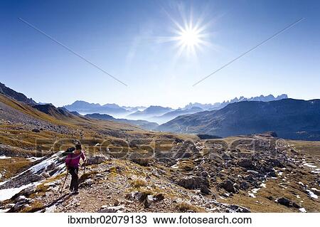 "Hikers heading to the Bepi Zac via ferrata in the San Pallegrino valley, above San Pellegrino Pass or Passo San Pellegrino, Dolomites in the back, Trentino, Italy, Europe" View Large Photo Image Stock Image - "Hikers heading to the Bepi Zac via ferrata in the San Pallegrino valley, above San Pellegrino Pass or Passo San Pellegrino, Dolomites in the back, Trentino, Italy, Europe". Fotosearch