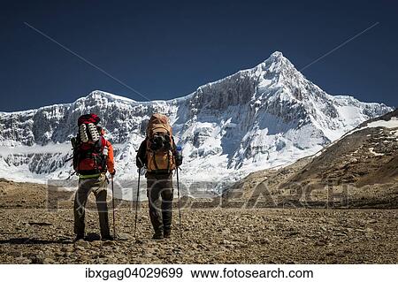 "Hikers in front of mountain with glacier, Monte San Lorenzo, Perito Moreno National Park, Patagonia, Argentina, South America" View Large Photo Image Stock Photo - "Hikers in front of mountain with glacier, Monte San Lorenzo, Perito Moreno National Park, Patagonia, Argentina, South America". Fotosearch
