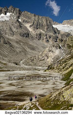 "Hikers on the Baechlisboden floodplain, with Baechlital Hut on a ledge, Baechli Valley, Bernese Alps, Switzerland, Europe" View Large Photo Image Picture - "Hikers on the Baechlisboden floodplain, with Baechlital Hut on a ledge, Baechli Valley, Bernese Alps, Switzerland, Europe". Fotosearch