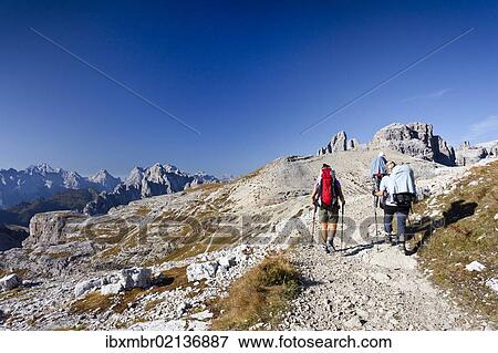 "Hikers on the Buellelejoch Pass during the ascent to Paternkofel Mountain, looking towards Paternkofel Mountain, the Three Peaks and the Cadini Group, Sesto, Alta Pusteria, Dolomites, Alto Adige, Italy, Europe" View Large Photo Image Stock Photo - "Hikers on the Buellelejoch Pass during the ascent to Paternkofel Mountain, looking towards Paternkofel Mountain, the Three Peaks and the Cadini Group, Sesto, Alta Pusteria, Dolomites, Alto Adige, Italy, Europe". Fotosearch