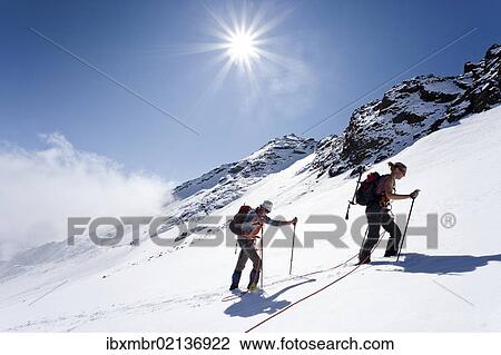 "Hikers on Weissbrunnferner Mountain during the ascent to Hinterer Eggenspitz Mountain in the Val d'Ultimo, with the summit of Hinterer Eggenspitz Mountain at the rear, Alto Adige, Italy, Europe" View Large Photo Image Stock Image - "Hikers on Weissbrunnferner Mountain during the ascent to Hinterer Eggenspitz Mountain in the Val d'Ultimo, with the summit of Hinterer Eggenspitz Mountain at the rear, Alto Adige, Italy, Europe". Fotosearch