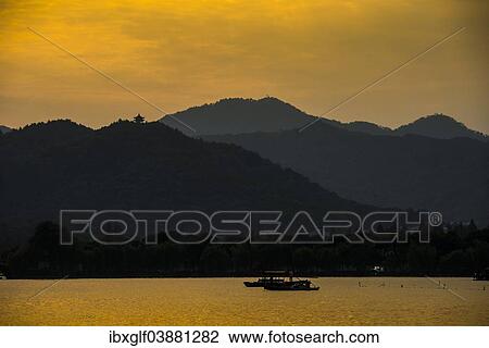 "Hills at West Lake at sunset, Xihu, Hangzhou, Zhejiang Province, China, Asia" View Large Photo Image Stock Image - "Hills at West Lake at sunset, Xihu, Hangzhou, Zhejiang Province, China, Asia". Fotosearch