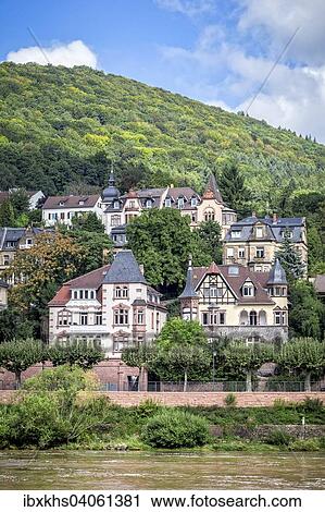 Stock Image - "Historic buildings on the banks of the Neckar river, Heidelberg, Baden-Wurttemberg, Germany, Europe". Fotosearch