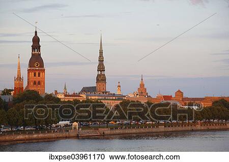 Stock Image - "Historic centre with the banks of the Daugava River, Riga Cathedral, St. Peter's Church, Academy of Sciences, from the Vansu Bridge or Vansu tilts over Daugava, Riga, Latvia, Europe". Fotosearch