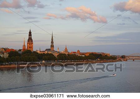 "Historic centre with the banks of the Daugava River, Riga Cathedral, St. Peter's Church, from the Vansu Bridge or Vansu tilts over Daugava, Riga, Latvia, Europe" View Large Photo Image Stock Image - "Historic centre with the banks of the Daugava River, Riga Cathedral, St. Peter's Church, from the Vansu Bridge or Vansu tilts over Daugava, Riga, Latvia, Europe". Fotosearch