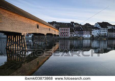 Stock Photo - "Historic wooden bridge crossing the Rhine River, connecting Gailingen with the Swiss town of Diessenhofen, Baden-Wurttemberg, Germany, Europe". Fotosearch