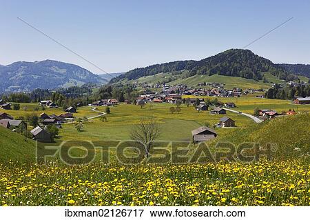 Stock Photo - "Hittisau village with Mt. Roter Berg, right, Bregenzerwald region, Vorarlberg, Austria, Europe". Fotosearch