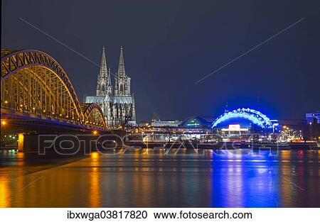 Stock Image - "Hohenzollern Bridge with Cologne Cathedral and the Musical Dome, bank of the Rhine, Cologne, Rhineland, North Rhine-Westphalia, Germany, Europe". Fotosearch