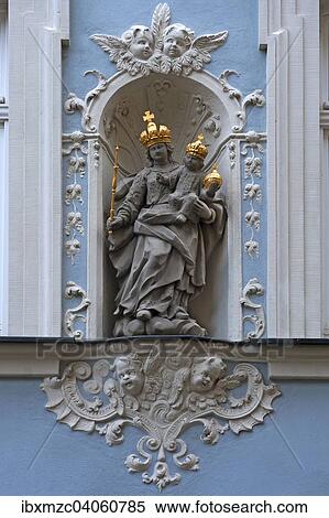 Stock Photography - "Holy sculpture, Madonna with the baby Jesus wearing golden crowns in a wall niche of a town house, Bamberg, Upper Franconia, Bavaria, Germany, Europe". Fotosearch