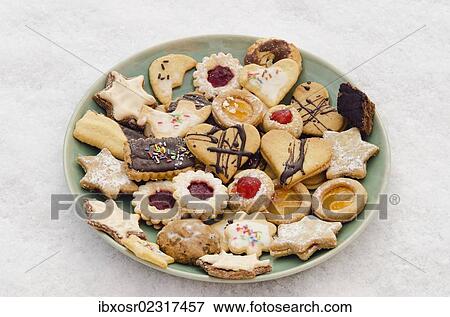 Stock Photo - "Homemade Christmas cookies on a plate on snow, Bavaria, Germany, Europe". Fotosearch