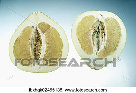 Stock Photo - "Honey Pomelo (Citrus maxima, Citrus grandis), cut in half". Fotosearch