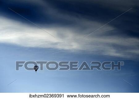 Stock Image - Hot air balloon in a storm. Fotosearch