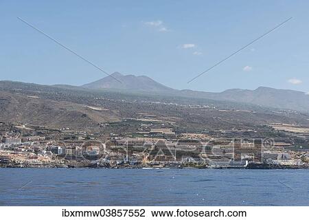 Stock Image - "Hotel complex, Los Gigantes, Pico del Teide or Mount Teide at the back, Puerto de Santiago, Tenerife, Canary Islands, Spain, Europe". Fotosearch
