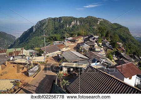 "Houses roofed with corrugated iron, road, village of the Akha hill tribe, Santikhiri or Mae Salong area, Chiang Rai province, northern Thailand, Thailand, Asia" View Large Photo Image Stock Photo - "Houses roofed with corrugated iron, road, village of the Akha hill tribe, Santikhiri or Mae Salong area, Chiang Rai province, northern Thailand, Thailand, Asia". Fotosearch