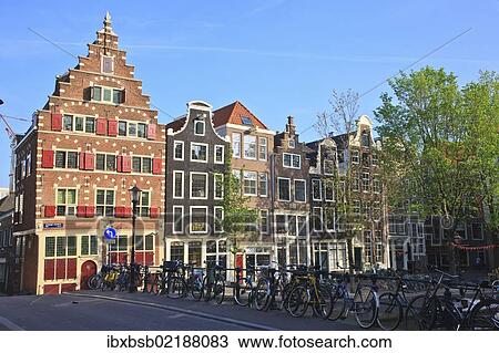 Stock Image - "Housing in the historic city centre of Amsterdam, Holland, Netherlands, Europe". Fotosearch