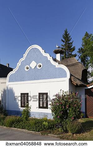 "Hufnagl house with stork's nest, Apetlon, Seewinkel, Northern Burgenland, Burgenland, Austria, Europe" View Large Photo Image Stock Photo - "Hufnagl house with stork's nest, Apetlon, Seewinkel, Northern Burgenland, Burgenland, Austria, Europe". Fotosearch