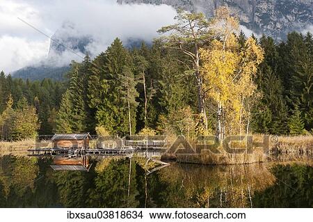"Hut and trees in autumn reflected in the Volser Weiher lake, Schlern-Rosengarten Nature Park, South Tyrolean Dolomites, Vols am Schlern or Fie allo Sciliar, Schlern region, Alto Adige, Trentino-Alto Adige, Italy, Europe" View Large Photo Image Picture - "Hut and trees in autumn reflected in the Volser Weiher lake, Schlern-Rosengarten Nature Park, South Tyrolean Dolomites, Vols am Schlern or Fie allo Sciliar, Schlern region, Alto Adige, Trentino-Alto Adige, Italy, Europe". Fotosearch