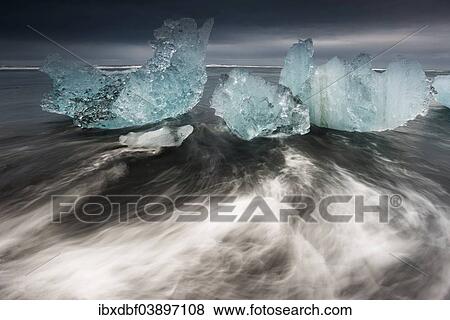 "Ice crystals on a black beach being lapped by the sea, Jokulsarlon Glacier Lagoon, Vatnajokull Glacier, Austurland, East Iceland, Iceland, Europe" View Large Photo Image Stock Photo - "Ice crystals on a black beach being lapped by the sea, Jokulsarlon Glacier Lagoon, Vatnajokull Glacier, Austurland, East Iceland, Iceland, Europe". Fotosearch
