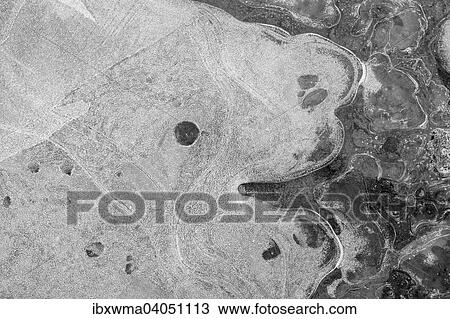"Ice patterns in a puddle, Hesse, Germany, Europe" View Large Photo Image Stock Image - "Ice patterns in a puddle, Hesse, Germany, Europe". Fotosearch