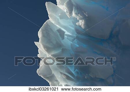 Stock Image - "Iceberg, detail with backlighting, Charlotte Bay, Antarctic Peninsula, Antarctica". Fotosearch