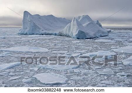 "Iceberg floating in pack ice, edge of pack-ice, Arctic Ocean, Spitsbergen Island, Svalbard Archipelago, Svalbard and Jan Mayen, Norway, Europe" View Large Photo Image Stock Photo - "Iceberg floating in pack ice, edge of pack-ice, Arctic Ocean, Spitsbergen Island, Svalbard Archipelago, Svalbard and Jan Mayen, Norway, Europe". Fotosearch