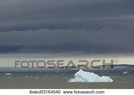 "Iceberg floating in Palanderbukta fjord during strong winds and storm clouds, Nordaustlandet, Svalbard Archipelago, Svalbard and Jan Mayen, Norway, Europe" View Large Photo Image Stock Image - "Iceberg floating in Palanderbukta fjord during strong winds and storm clouds, Nordaustlandet, Svalbard Archipelago, Svalbard and Jan Mayen, Norway, Europe". Fotosearch
