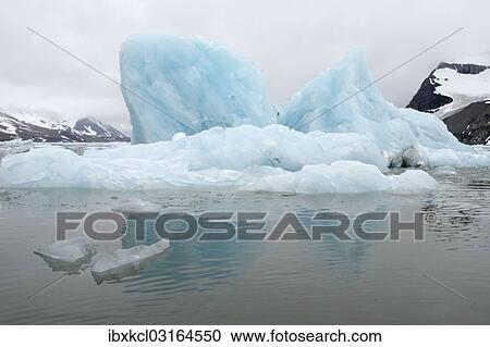 "Iceberg reflections on cloudy day in the waters of Samarinvagen Bay in Hornsund, Spitsbergen Island, Svalbard Archipelago, Svalbard and Jan Mayen, Norway, Europe" View Large Photo Image Stock Image - "Iceberg reflections on cloudy day in the waters of Samarinvagen Bay in Hornsund, Spitsbergen Island, Svalbard Archipelago, Svalbard and Jan Mayen, Norway, Europe". Fotosearch