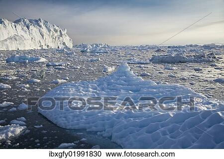 "Iceberg shaped by wind and rain, Greenland, North America" View Large Photo Image Stock Image - "Iceberg shaped by wind and rain, Greenland, North America". Fotosearch