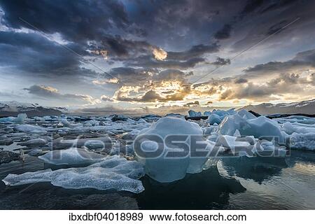 "Icebergs, dramatic clouds, glacier lagoon Jokulsarlon in the evening sun, Vatnajokull Glacier, Eastern Region, Iceland, Europe" View Large Photo Image Stock Photo - "Icebergs, dramatic clouds, glacier lagoon Jokulsarlon in the evening sun, Vatnajokull Glacier, Eastern Region, Iceland, Europe". Fotosearch