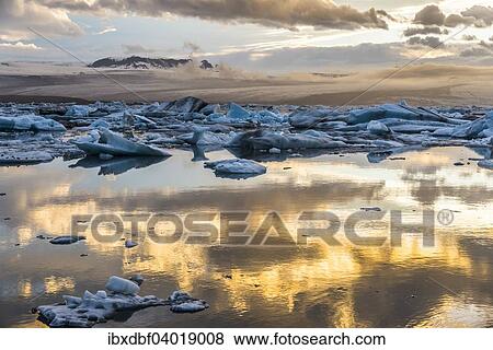 "Icebergs, dramatic clouds, Jokulsarlon glacial lagoon in the evening sun, Vatnajokull Glacier, Eastern Region, Iceland, Europe" View Large Photo Image Stock Photo - "Icebergs, dramatic clouds, Jokulsarlon glacial lagoon in the evening sun, Vatnajokull Glacier, Eastern Region, Iceland, Europe". Fotosearch