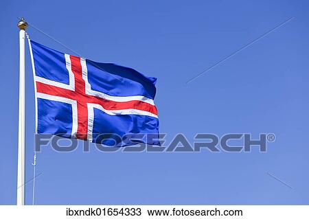 Stock Image - "Icelandic national flag blowing in the wind, Iceland, Europe". Fotosearch