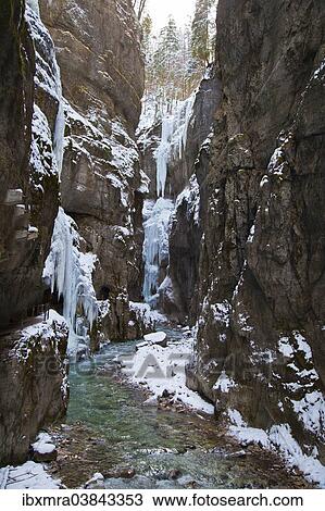 "Icy gorge with a mountain stream and steep rock walls, Partnach Gorge, near Garmisch-Partenkirchen, Upper Bavaria, Bavaria, Germany, Europe" View Large Photo Image Stock Image - "Icy gorge with a mountain stream and steep rock walls, Partnach Gorge, near Garmisch-Partenkirchen, Upper Bavaria, Bavaria, Germany, Europe". Fotosearch