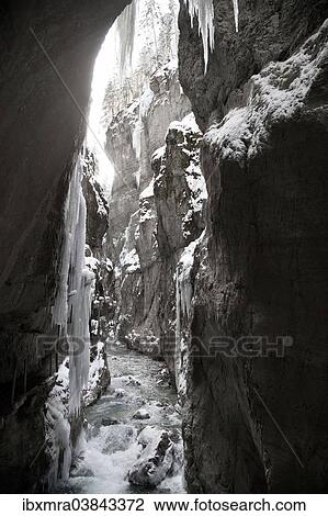 "Icy gorge with a mountain stream and steep rock walls, view out of a cave, Partnach Gorge, near Garmisch-Partenkirchen, Upper Bavaria, Bavaria, Germany, Europe" View Large Photo Image Stock Image - "Icy gorge with a mountain stream and steep rock walls, view out of a cave, Partnach Gorge, near Garmisch-Partenkirchen, Upper Bavaria, Bavaria, Germany, Europe". Fotosearch