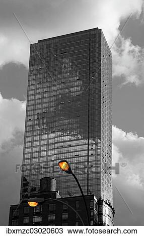 "Iluminated street lamps and a wooden water storage on a roof in front of a skyscraper, Manhattan, Down Town, New York City, New York, United States, North America" View Large Photo Image Stock Image - "Iluminated street lamps and a wooden water storage on a roof in front of a skyscraper, Manhattan, Down Town, New York City, New York, United States, North America". Fotosearch