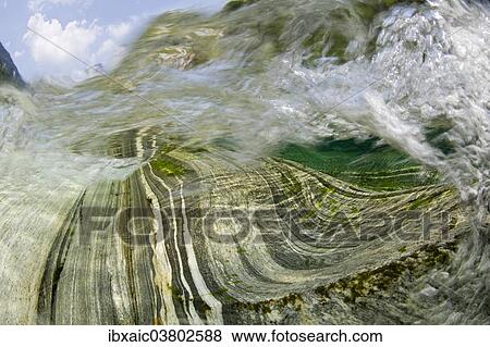 Stock Photo - "Inside a waterfall in the Verzasca River, Lavertezzo, Valle Verzasca, Canton Ticino, Switzerland, Europe". Fotosearch