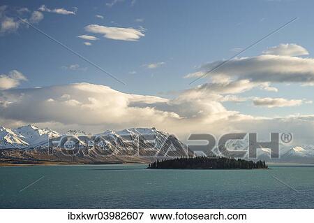 "Island in Lake Tekapo in front of a mountain range, Canterbury Region, South Island, New Zealand, Oceania" View Large Photo Image Stock Photo - "Island in Lake Tekapo in front of a mountain range, Canterbury Region, South Island, New Zealand, Oceania". Fotosearch