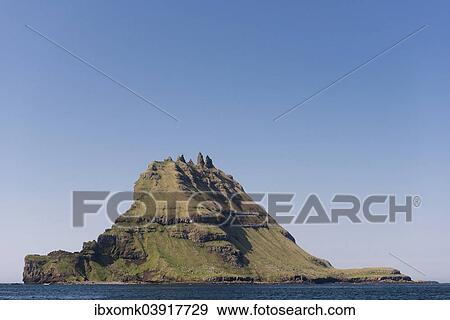 "Islet of Tindholmur or Tindholmur, rugged cliffs rising from the sea, Vagar, Faroe Islands, Denmark, Europe" View Large Photo Image Stock Photo - "Islet of Tindholmur or Tindholmur, rugged cliffs rising from the sea, Vagar, Faroe Islands, Denmark, Europe". Fotosearch