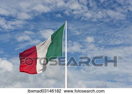 Italian flag against cloudy sky View Large Photo Image Stock Image - Italian flag against cloudy sky. Fotosearch