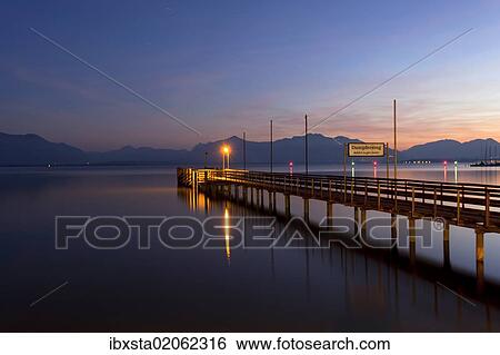 "Jetty at dusk, Seebruck on Chiemsee Lake, Bavaria, Germany, Europe, PublicGround, Europe" View Large Photo Image Stock Photograph - "Jetty at dusk, Seebruck on Chiemsee Lake, Bavaria, Germany, Europe, PublicGround, Europe". Fotosearch